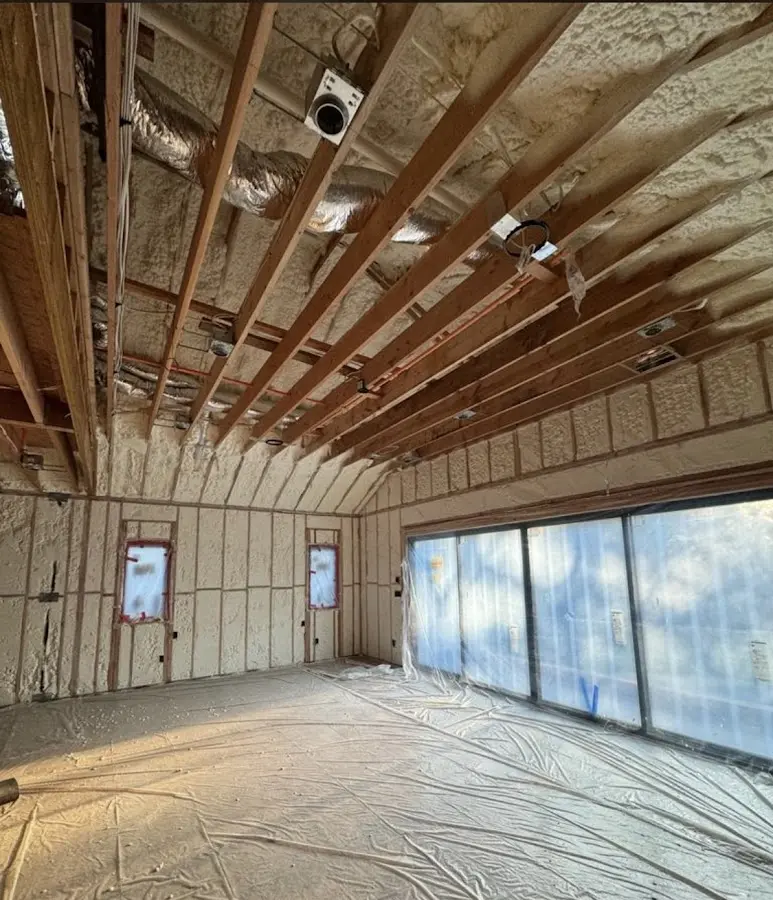 Interior walls and ceiling insulated with spray foam during new construction in Branchburg